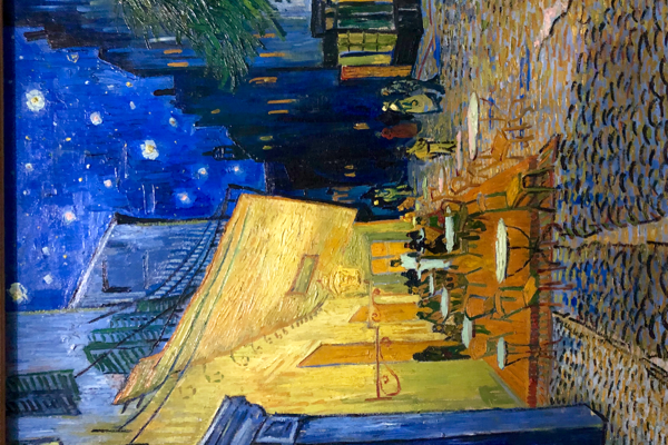 Terrace of a Café at Night